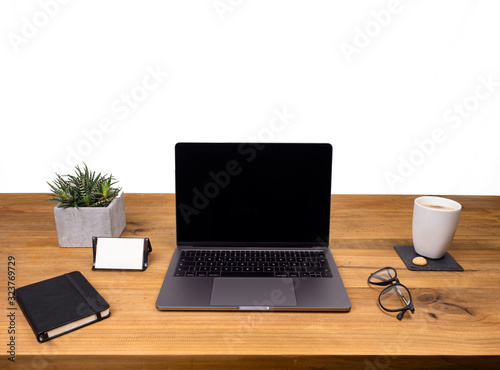 Table shot desk view with pencil a plant, coffee, workspace, business, laptop display and notes business card