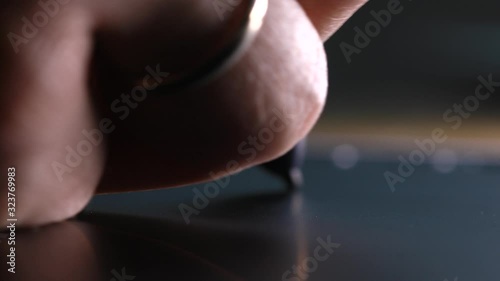 Close-up of hand drawing on a digital tablet with pencil. Macro view. Professional retoucher working on graphic tablet.