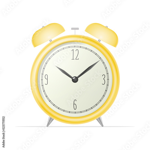 Realistic desk clock. Yellow retro alarm clock isolated on a white background. Retro watch. Windy illustration.