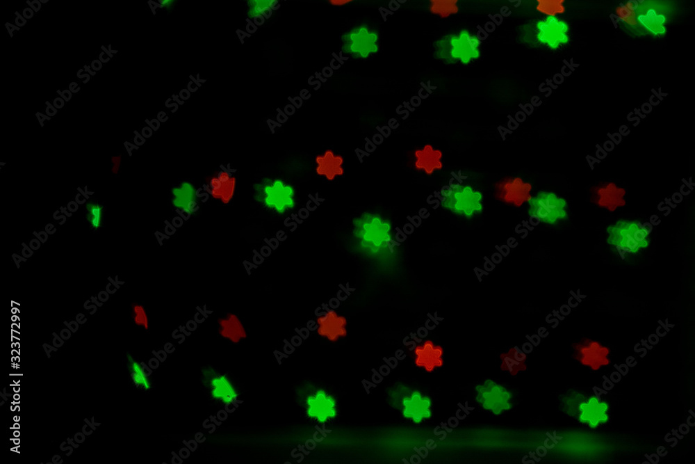 Bokeh in the form of snowflakes of red and green