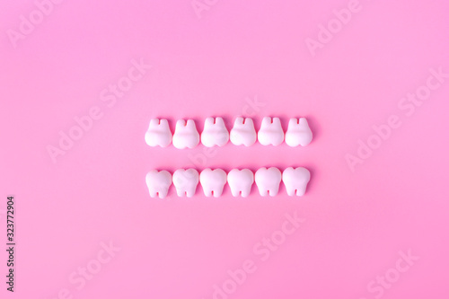 Dental background with models of teeth in two lines photo