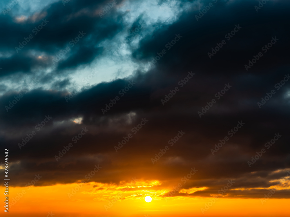 Obraz premium Fantastic dark thunderclouds at sunrise