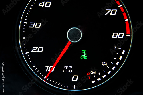 Eco car odometer with CNG tank.