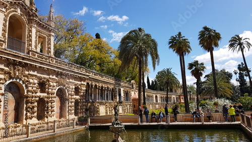 Real Alcazar Gardens in Seville Spain with water pool