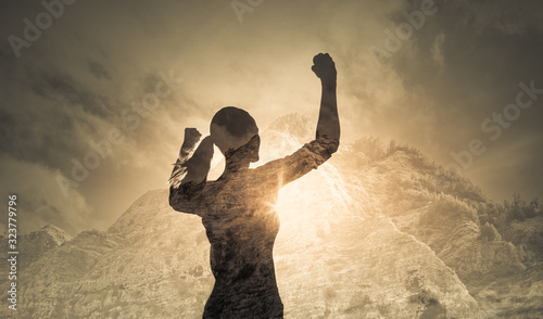 Strong determined female with hand raised to the sky. People power, victory concept