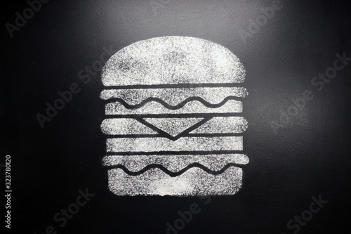 Vászonkép Hamburger. Drawing on a black chalkboard