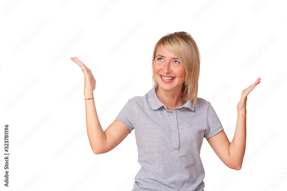 A young beautiful girl stands smiling and holding her hands up A young beautiful girl stands smiling and holding her hands up