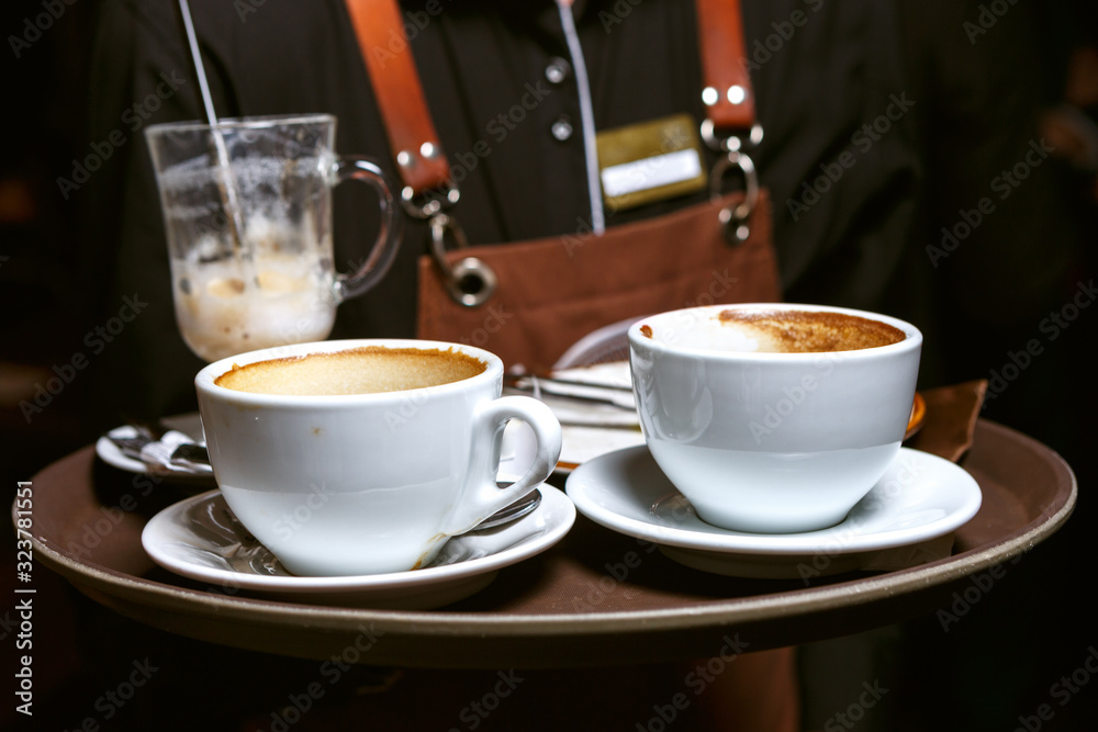 Used coffee cups on a tray Used coffee cups on a tray