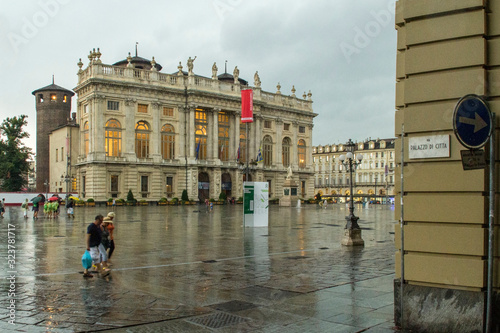 Looking across Piazza Castello Turnin Italy on a rainy afternoon photo