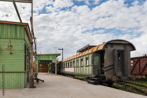 Vintage train platform with old trains and wooden buildings