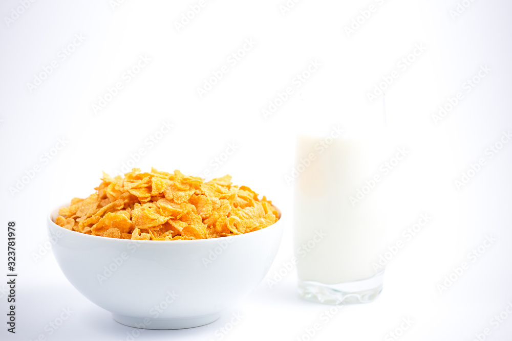 Natural corn flake breakfast cereal in cups and milk is a healthy breakfast that is good for your body every day on a white background. Natural corn flake breakfast cereal in cups and milk is a healthy breakfast that is good for your body every day on a white background.