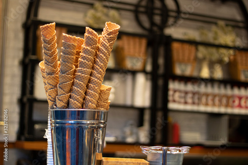Close-up photo of cones in front of the ice cream shop. photo