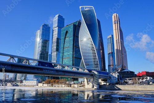 Beautiful landscape with a view of the river and skyscrapers in Moscow against the blue sky