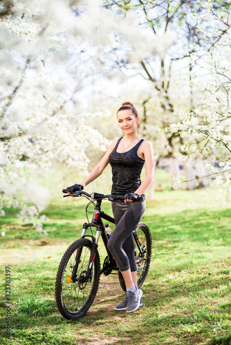 girl in nature with a Bicycle in good shape. Sports lifestyle and healthy lifestyle concept