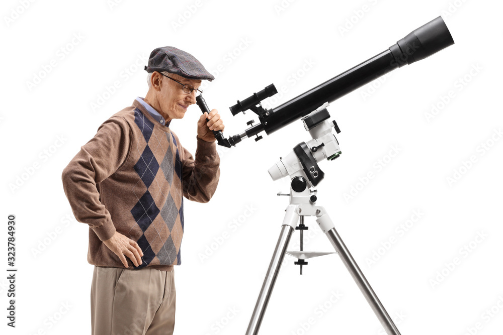 Senior man looking through a telescope