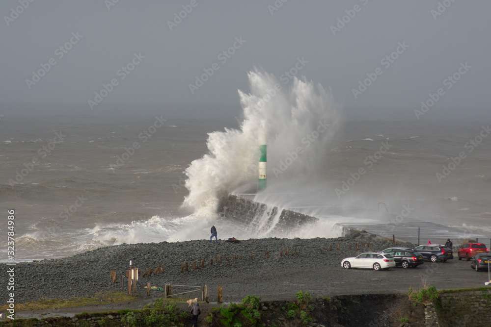 Storm Dennis creates big waves that crash into the seaside town of Aberystwyth , Wales.