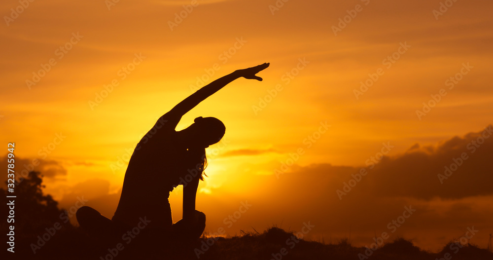 Young woman exerting stretching early morning. 