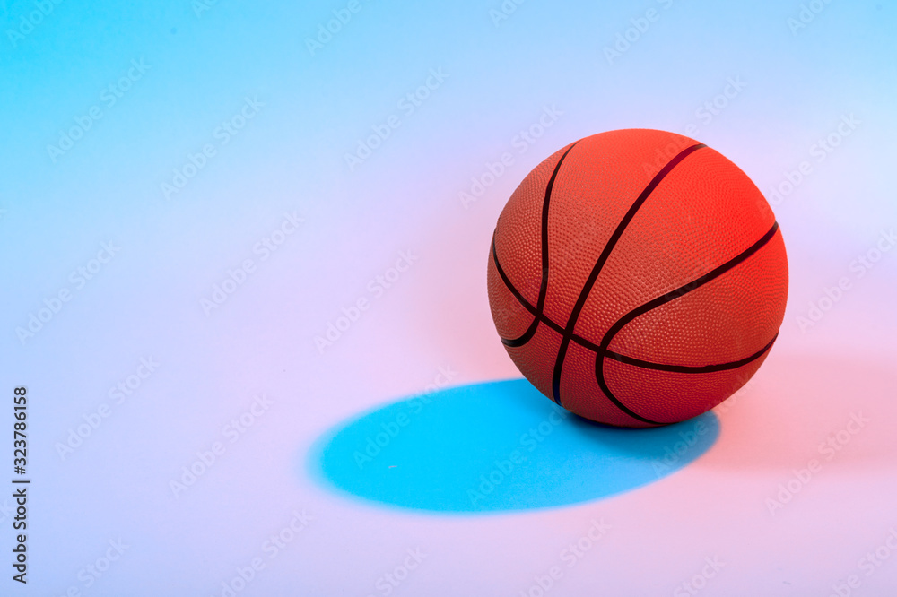 Basketball ball isolated on black background. Blue neon Banner Art concept
