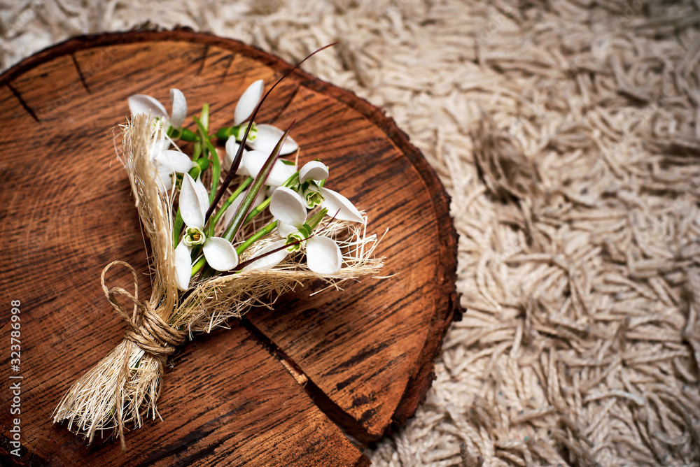 Snowdrop flowers bouquet on rustic background Snowdrop flowers bouquet on rustic background