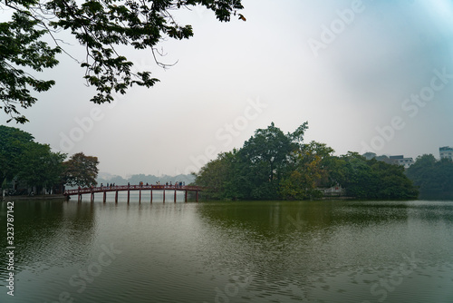 Hoan Kiem Lake, Hanoi Ba Dinh District, Vietnam. Reflection of trees and leaves in the water. Relaxing atmosphere. Beautiful view.