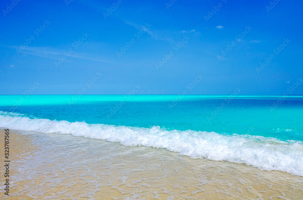 Tropical white sand beach, turquoise water and blue sky. Tropical white sand beach, turquoise water and blue sky.