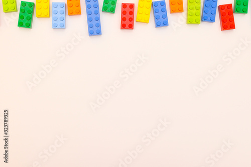 Plastic bricks for kids in different colors on the table