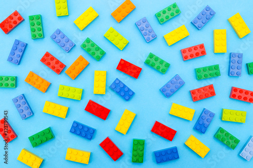 Plastic bricks for kids in different colors on the table