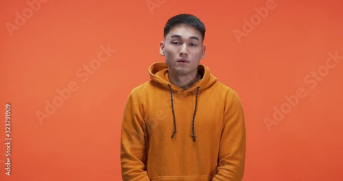 Young man rolling his eyes