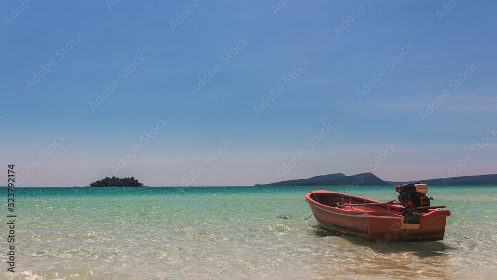 A red boat at the beach on Koh Rong Island, Cambodia