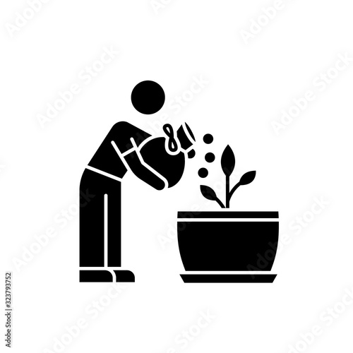 Fertilizing seedling black glyph icon. Feeding sapling. Plant growing, planting. Indoor gardening. Growth supplements, amendments. Silhouette symbol on white space. Vector isolated illustration