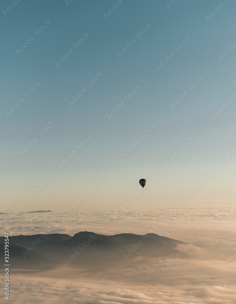 Image of some hot air balloons flying through the blue sky Image of some hot air balloons flying through the blue sky