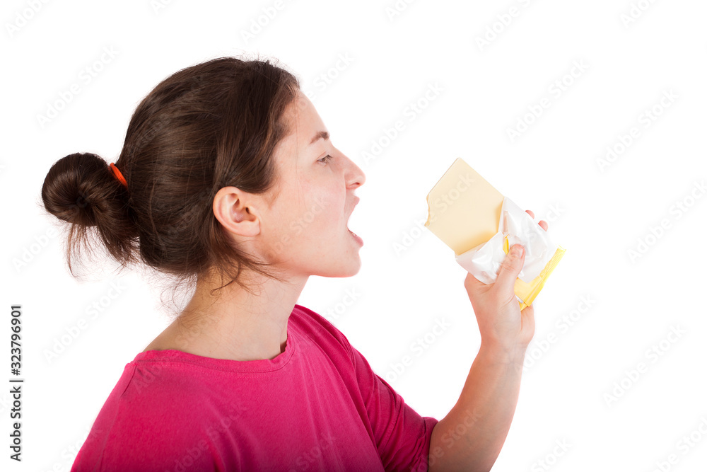 girl eating white chocolate isolated in studio girl eating white chocolate isolated in studio