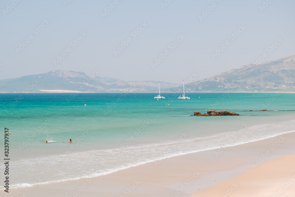 Obraz premium Beach dunes and turquoise water in Tarifa, Andalusia, Spain