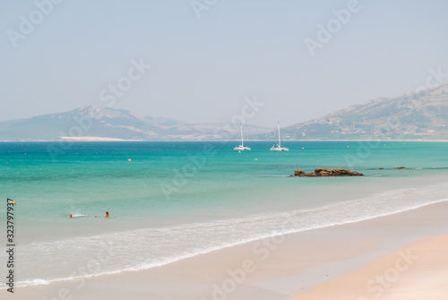 Beach dunes and turquoise water in Tarifa, Andalusia, Spain