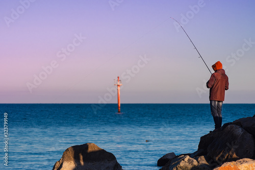 Morning fishing on the seashore.