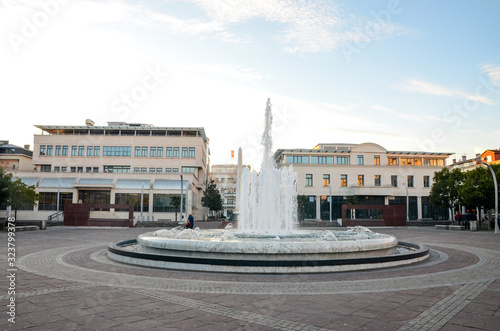 Podgorica, Montenegro city centre. Buildings, fountain and obelisk in Republic Square. Trg Republike.