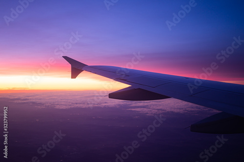 wing view plane in the sky sunrise