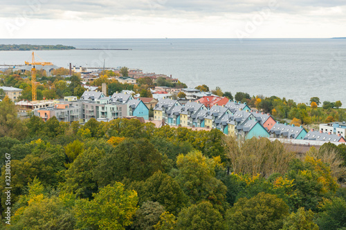 Kalamaja district seen from the tower of St. Olaf's church. Modern colourful houses by the Baltic sea in Tallinn, Estonia seen on a cloudy autumn day.