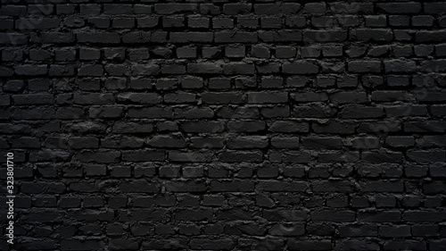 Black brick wall as background or wallpaper or texture