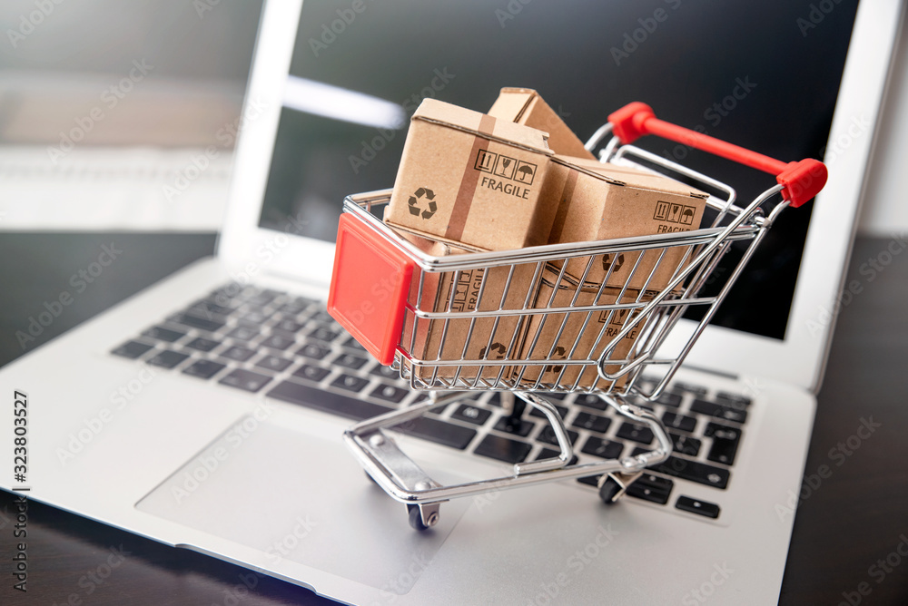 e-commerce, shopping trolley with paper boxes e-commerce, shopping trolley with paper boxes