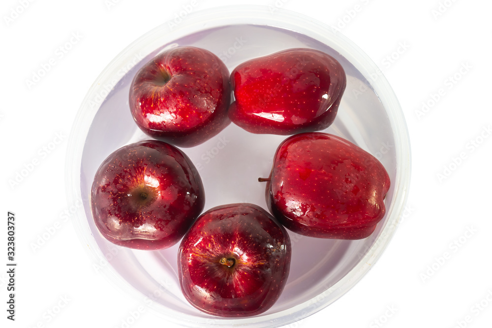 Apple soaked in water on white background. Apple soaked in water on white background.