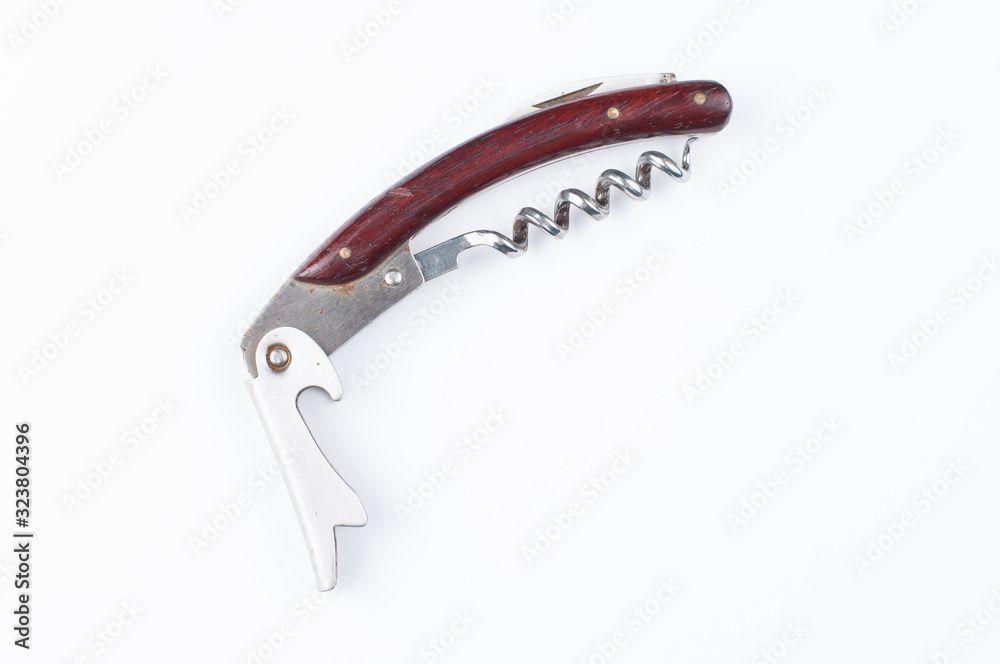 Corkscrew and wine cork isolated on white background.Copy space Corkscrew and wine cork isolated on white background.Copy space