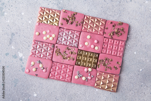 Pink ruby chocolate bars with gold, silver and crisp