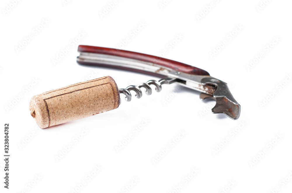 Corkscrew and wine cork isolated on white background.Copy space Corkscrew and wine cork isolated on white background.Copy space