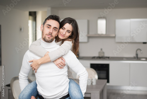 Happy couple in their home