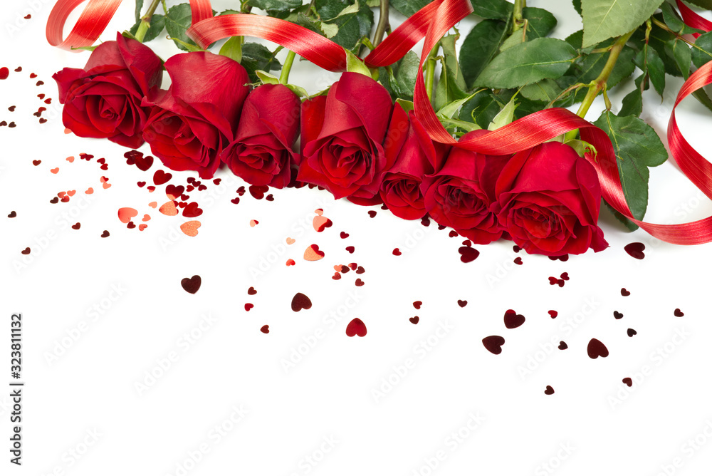 freshly cutted red roses with hearts forming a frame on white background. copy space. Flowers, womens day, mother day, Birthday or st Valentine concept freshly cutted red roses with hearts forming a frame on white background. copy space. Flowers, womens day, mother day, Birthday or st Valentine concept