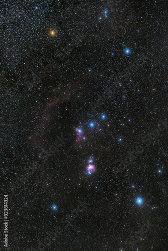 Betelgeuse star in constellation of Orion (top left yellow star) photo
