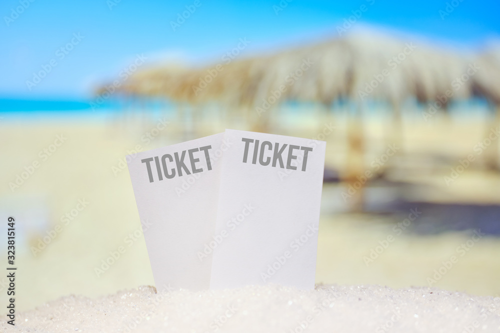 Beautiful blurred view of the beach and sand with travel tickets. Beautiful blurred view of the beach and sand with travel tickets.