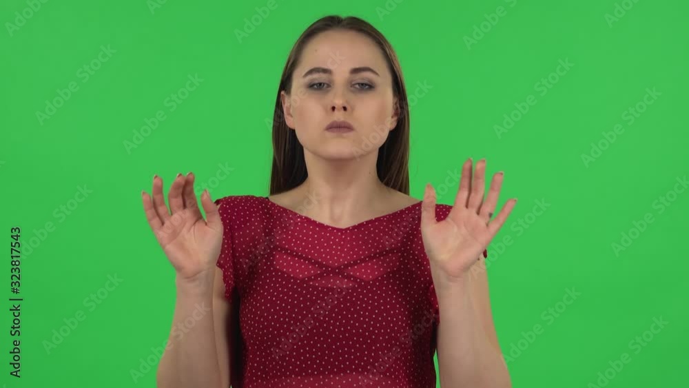 Portrait of tender girl is refusing stress and taking situation, calming down, breathing deeply. Green screen Portrait of tender girl is refusing stress and taking situation, calming down, breathing deeply. Green screen