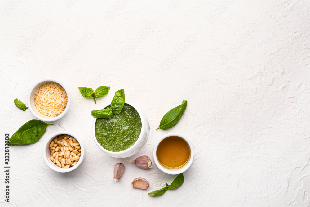 Pesto sauce with ingredients on white background Pesto sauce with ingredients on white background